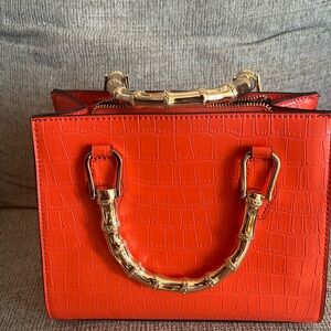 Aldo Orange Crossbody Bag with Gold Handles